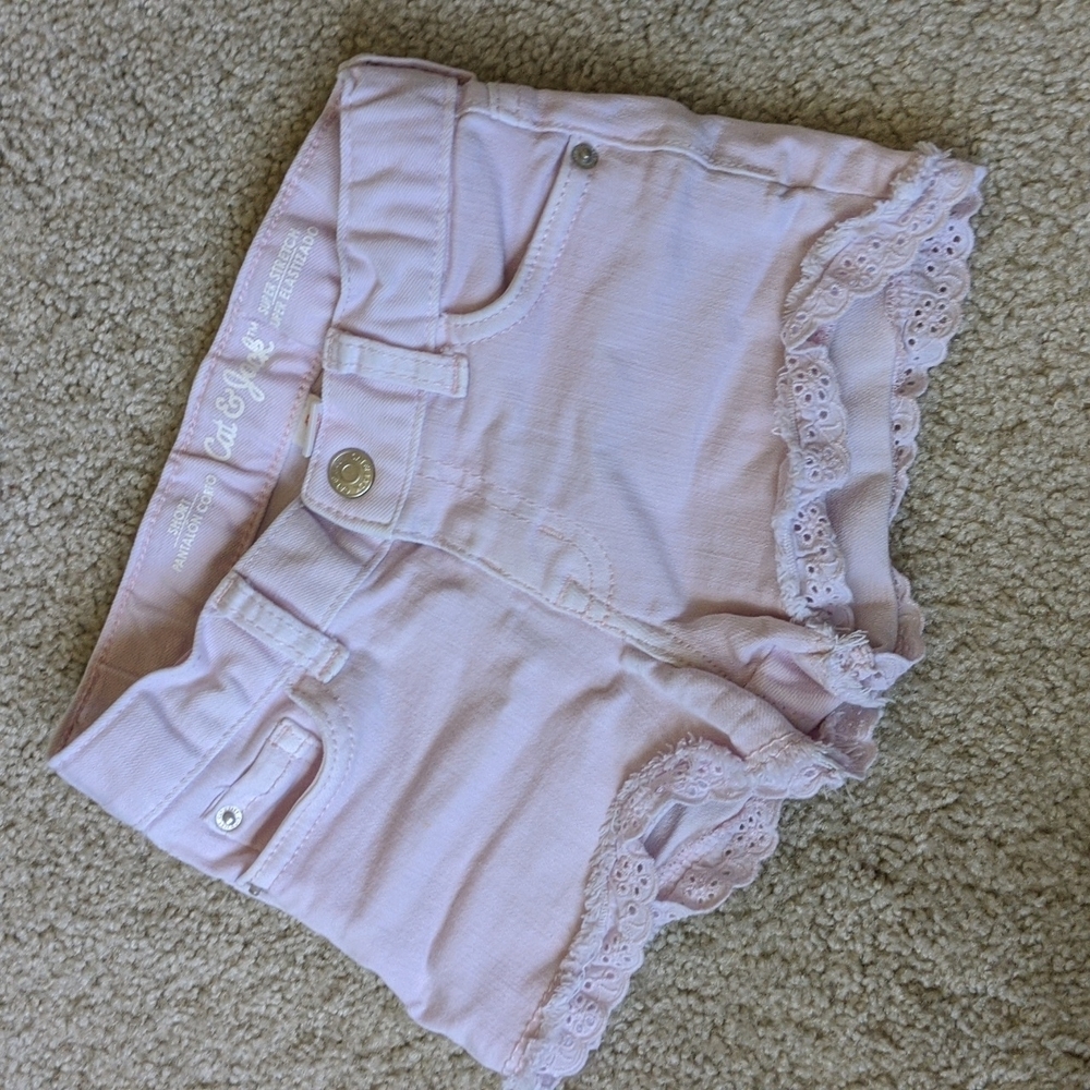 Pink cutoffs with eyelet trim